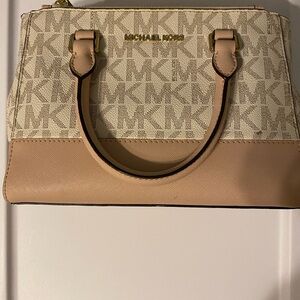 Nude color Michael Kors Cross body purse with handles and gold accents
